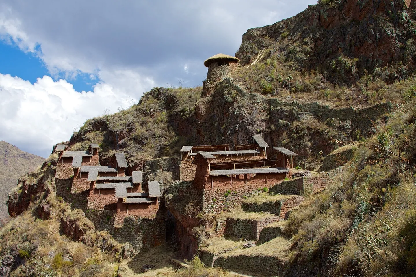 The buildings of Pisac meld beautifully into the rock and slope like they are natural extensions of the mountain.